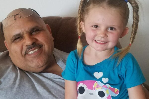 Abbas with one of his grandchildren