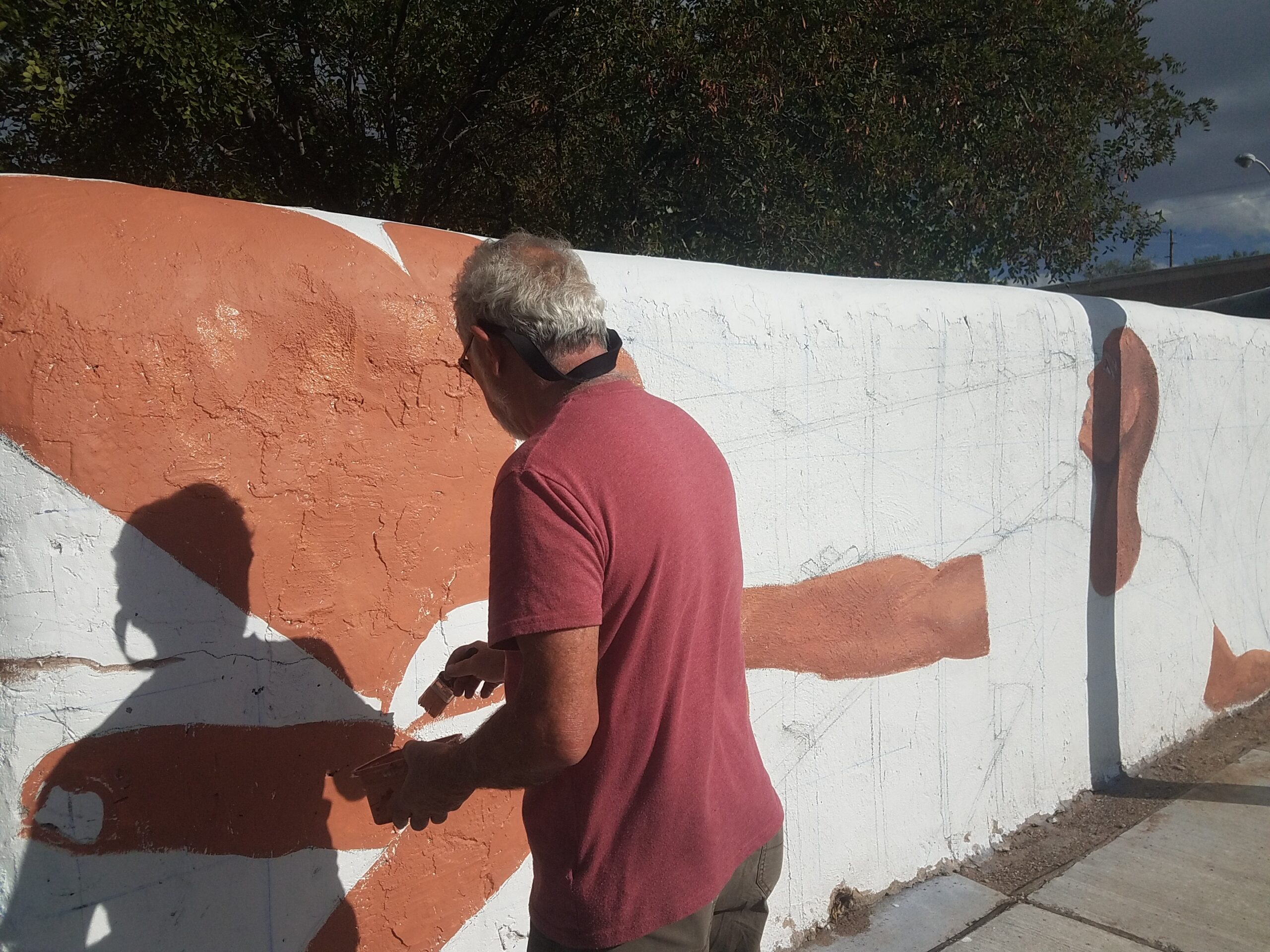 Emanuel Martinez painting at 508 Mural Fest