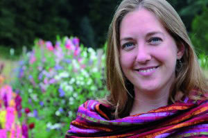 Photo: A woman with shoulder length blonde hair facing forward, shown from the shoulders up