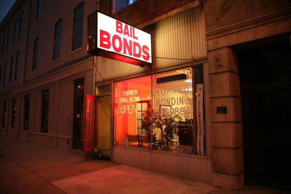 Photo of the outside of a bail bond office at night time