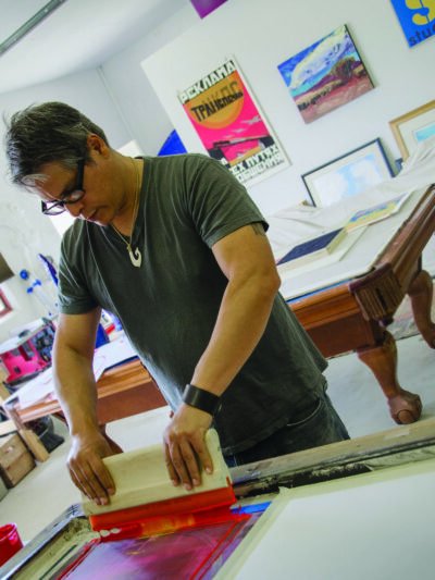 Mateo Romero working in his studio.