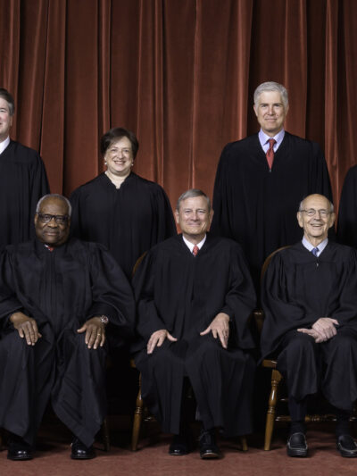 Photo of the Supreme Court Justices in black robes as composed October 27, 2020.
