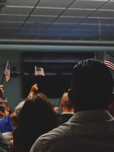 Title 42 Op-Ed, Immigrants Waving American Flags