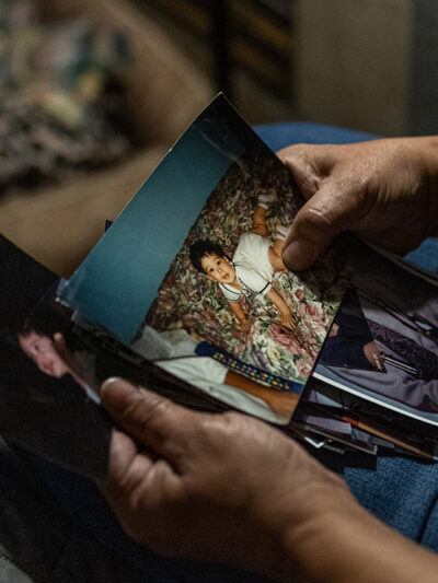 An ACLU client looking at family photos.