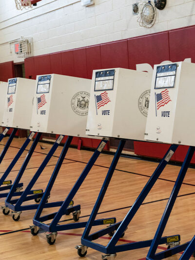 Voting booths lined up at polling station during in a public school in Brooklyn, New York.