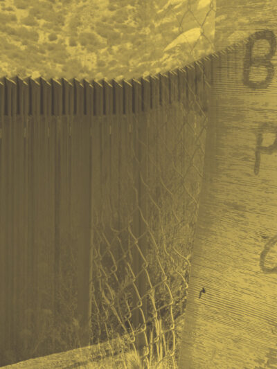 A sign that says border patrol only with a border fence.