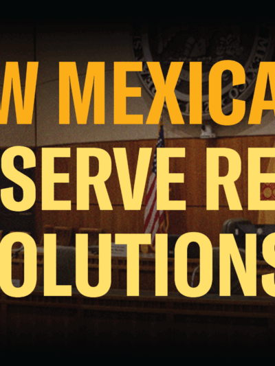 Banner image of the interior chamber of the Roundhouse with yellow text over it that reads: New Mexicans Deserve Real Solutions