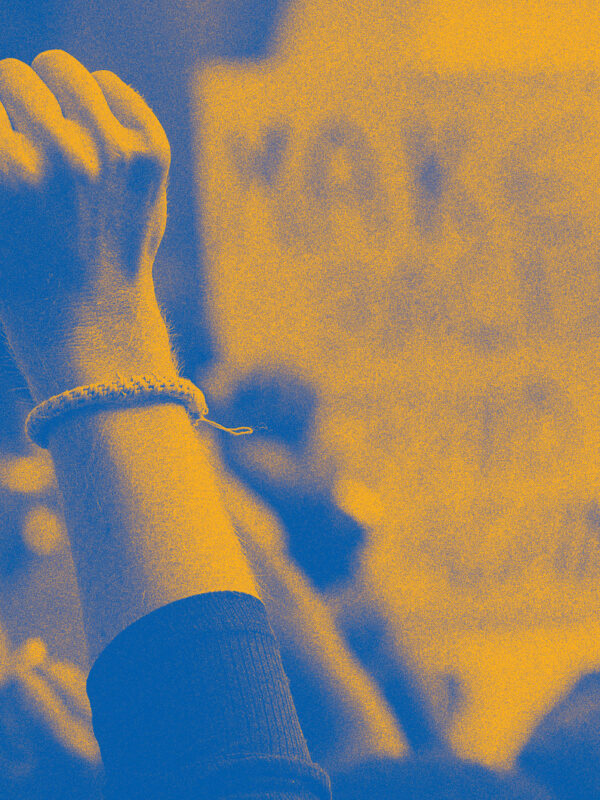 Stylized image of raised fists at a protest or rally.