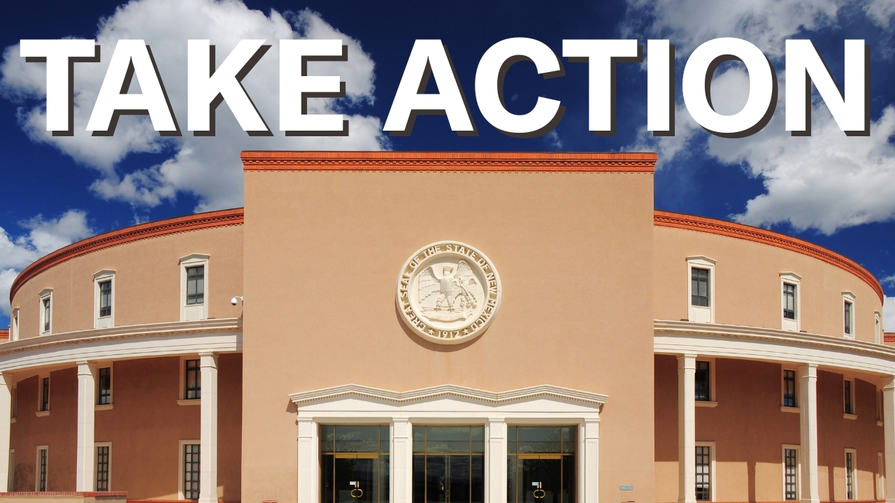 The words take action over the New Mexico State Capitol.