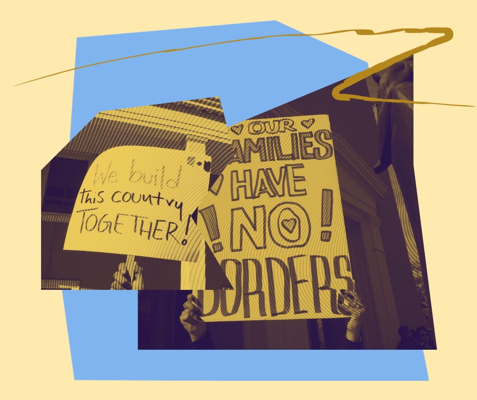 Two signs that read "We build this country together" and "our families have no borders"