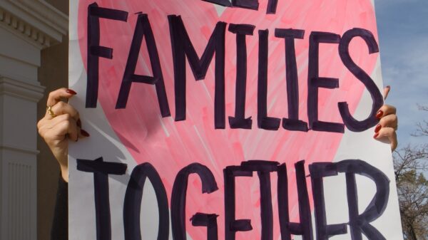 A protest sign that reads "Keep families together"
