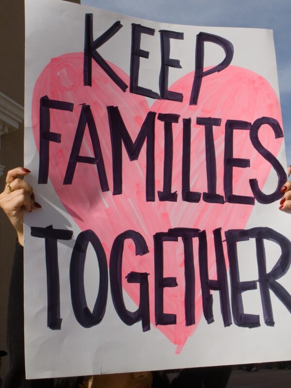 A protest sign that reads "Keep families together"