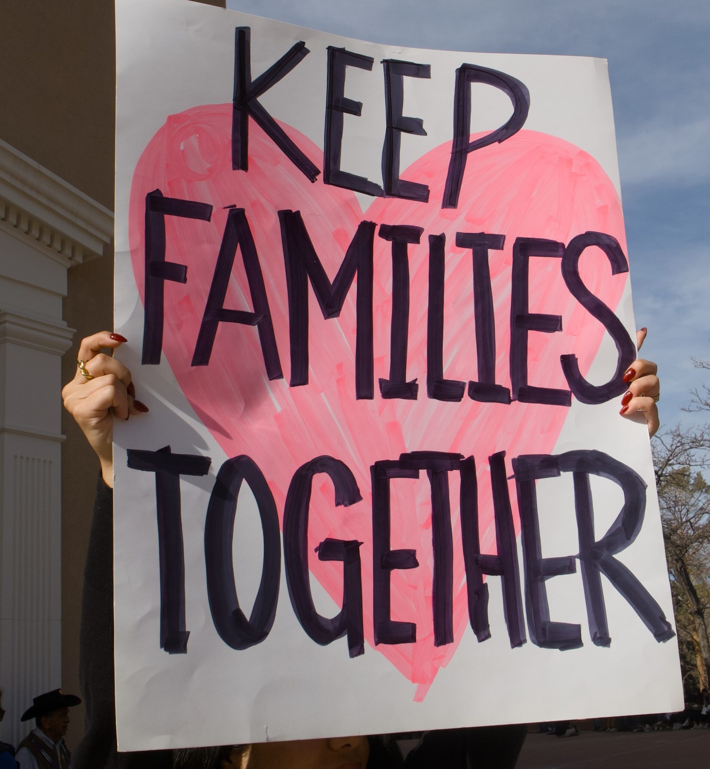 A protest sign that reads "Keep families together"