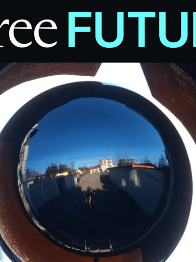 A closup of big camera eye with a house walkway reflected in the lens