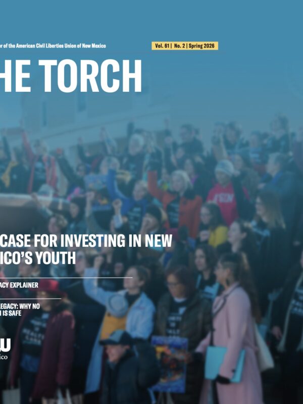 The cover of the Spring 2026 torch that shows a group of activists at the state capitol in Santa Fe with their fists raised.