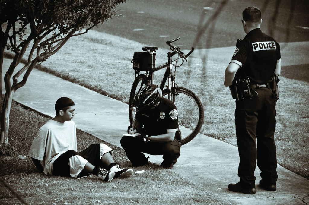 Man being arrested by police Man being arrested by police