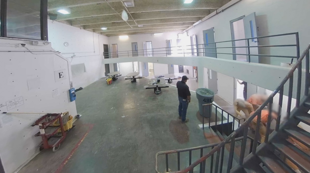 A prison guard watches as a person is assaulted in CNMCF. 