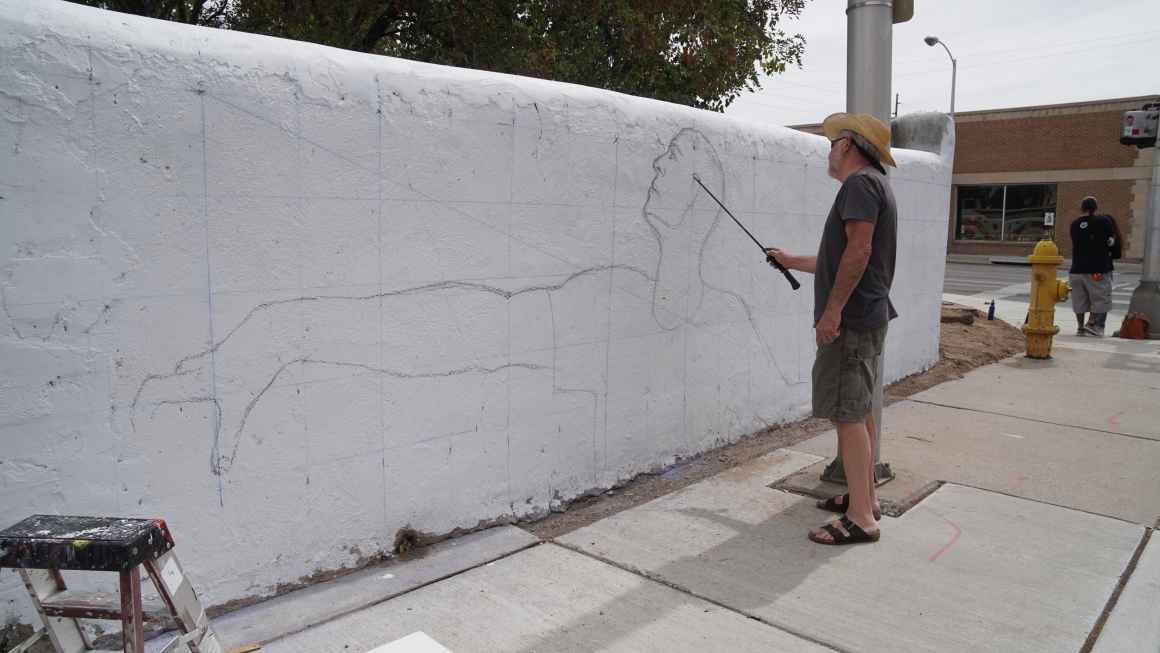 Emanuel Martinez painting at 508 Mural Fest 