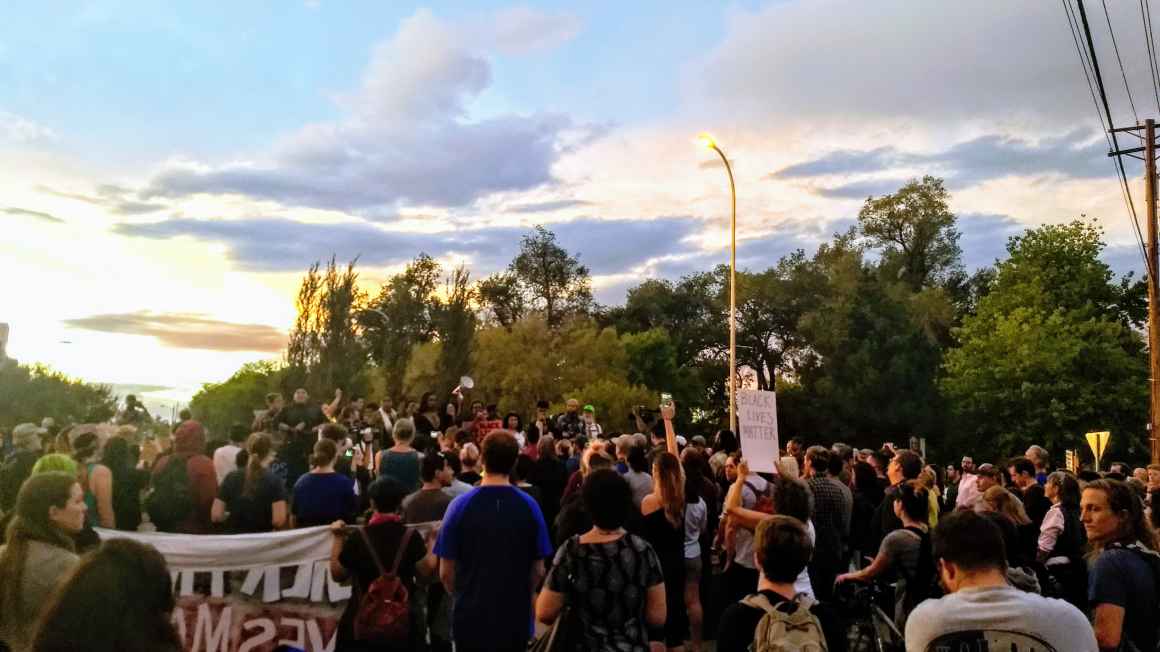 Photo: a crowd of people to hear speakers after a Black Lives Matter March