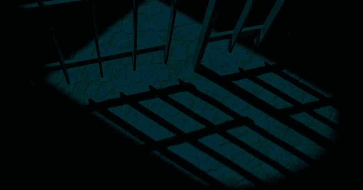 A dark and ominous picture of a prison cell.