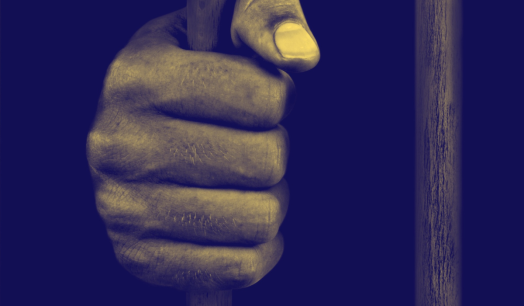 A hand holding a bar.