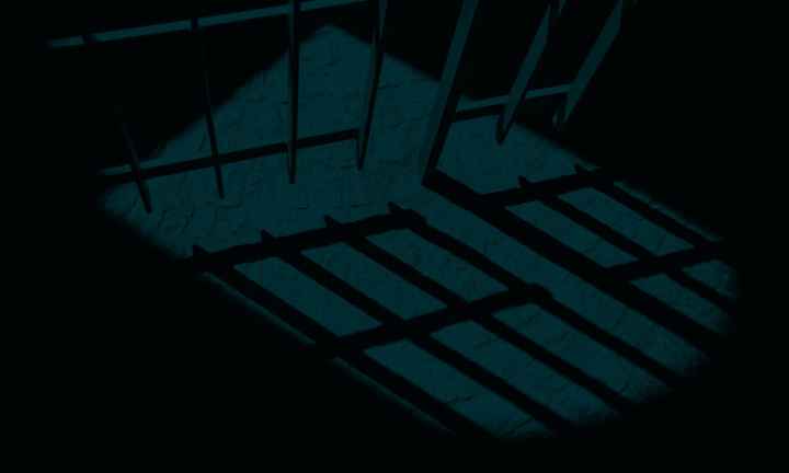 A dark and ominous picture of a prison cell.