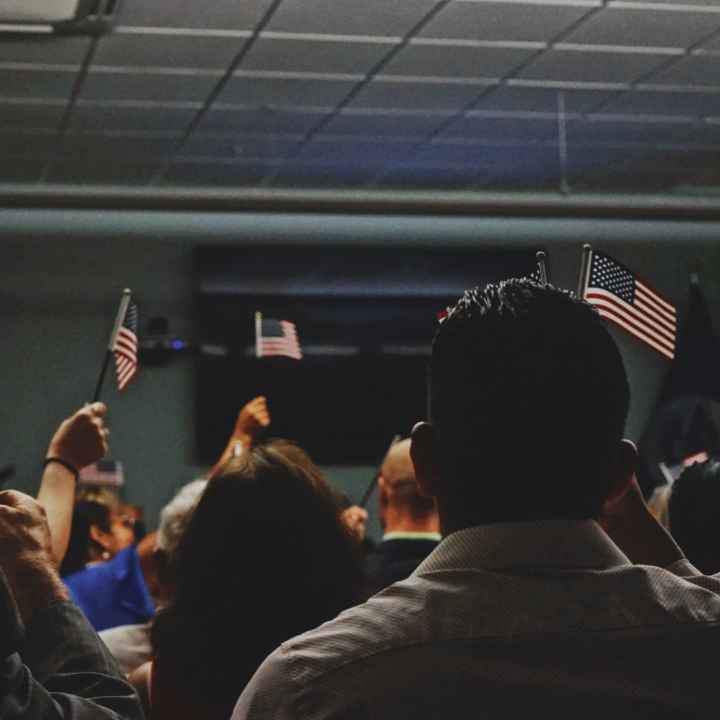 Title 42 Op-Ed, Immigrants Waving American Flags