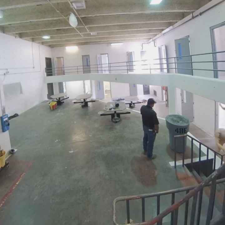A prison guard watches as a person is assaulted in CNMCF. 