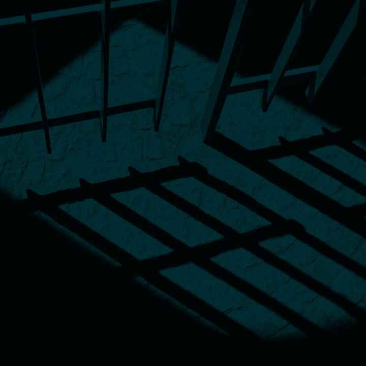 A dark and ominous picture of a prison cell.